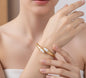 Elegant Gold-Plated Open Bypass Bangle with Teardrop Pearl Accents