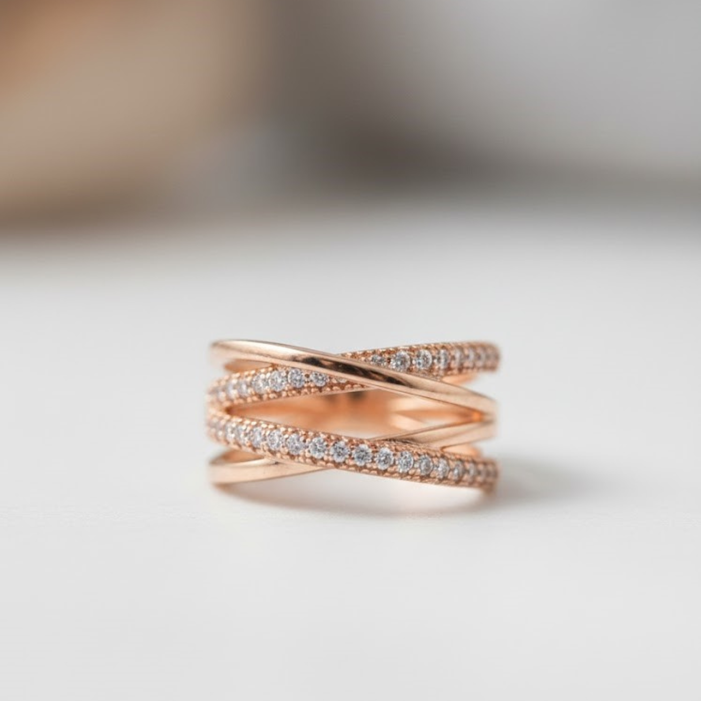 Elegant Rose Gold Intertwined Criss-Cross Fine Jewelry Ring with Sparkling Zirconia