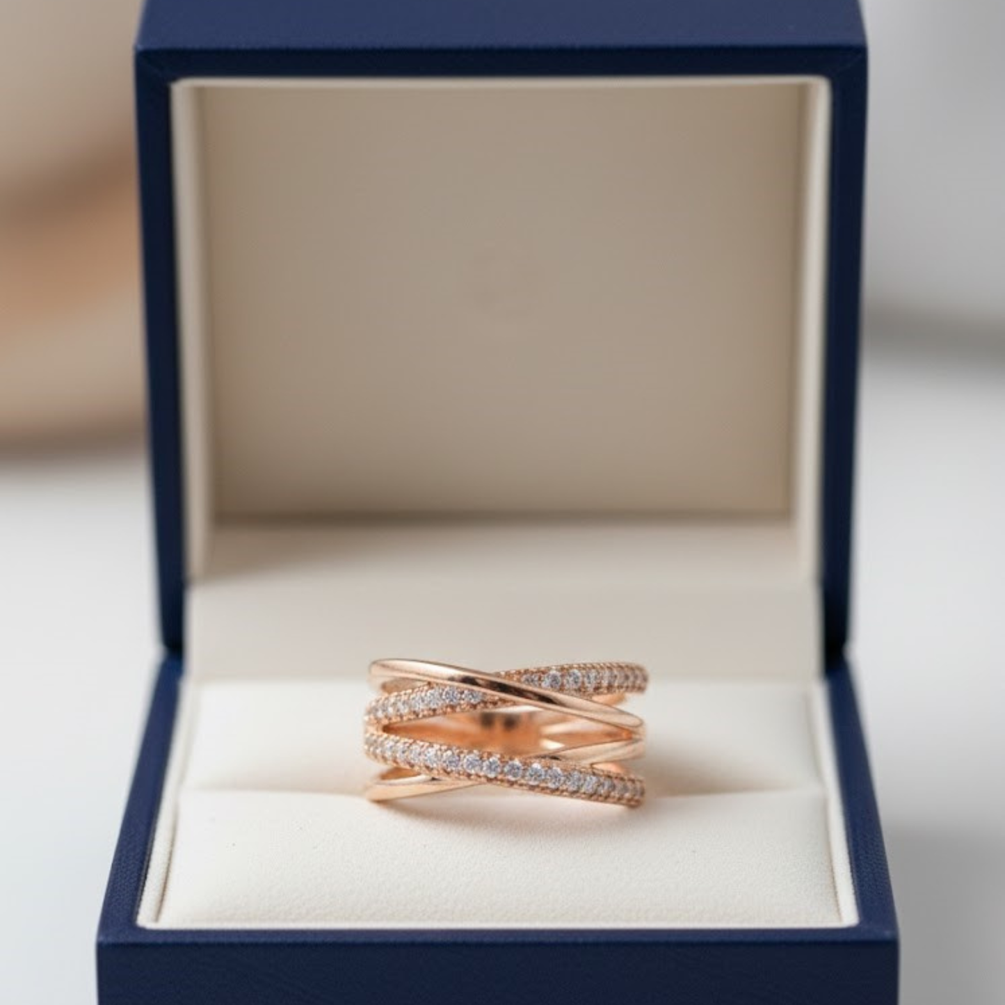 Elegant Rose Gold Intertwined Criss-Cross Fine Jewelry Ring with Sparkling Zirconia